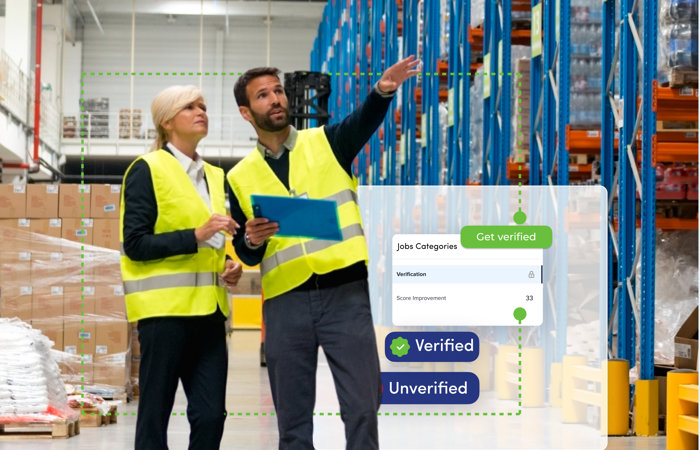 a man and woman in safety vests in a warehouse