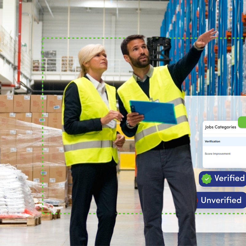 a man and woman in safety vests in a warehouse